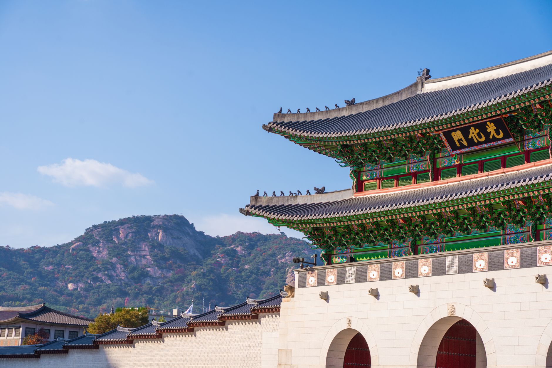 Bukhansan granite peaks rising above Seoul autumn forest