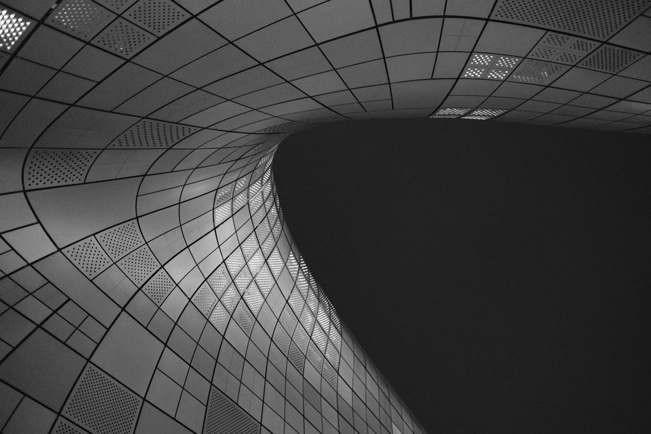 Dongdaemun Design Plaza silver curved architecture at night