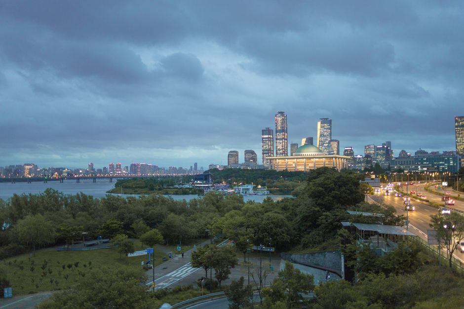 Han River Seoul park with city skyline at sunset