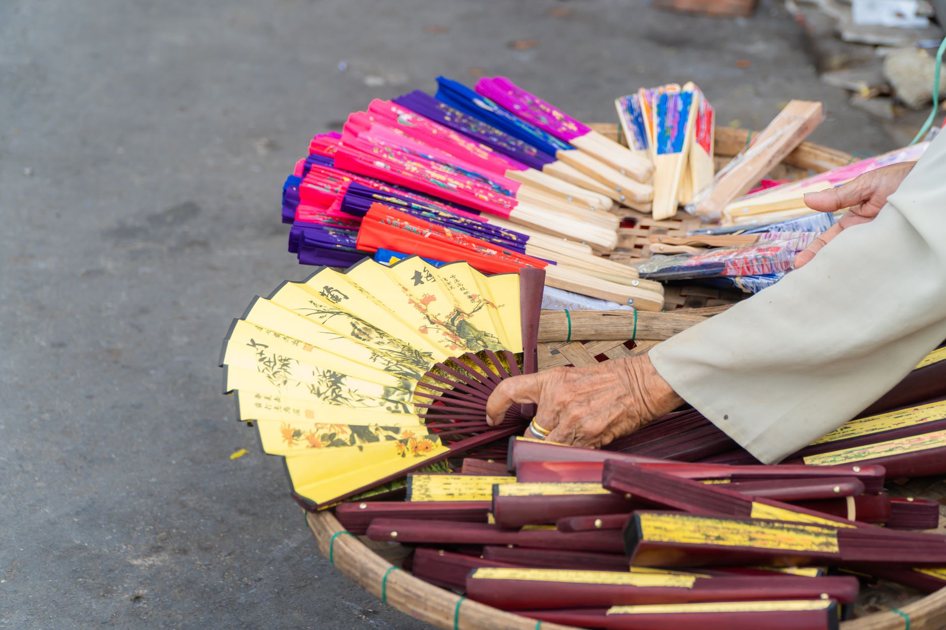 Korean craft market with handmade ceramics and fans