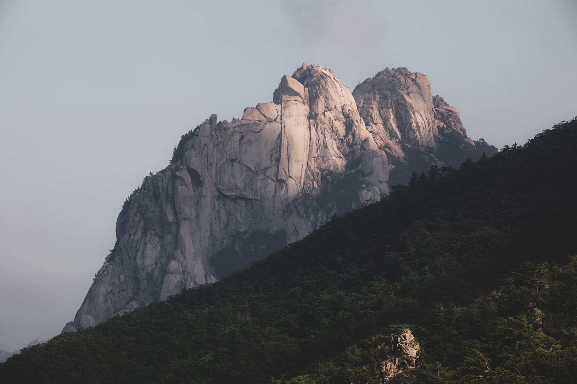 Korean mountain hiking trail along granite ridge with fortress wall