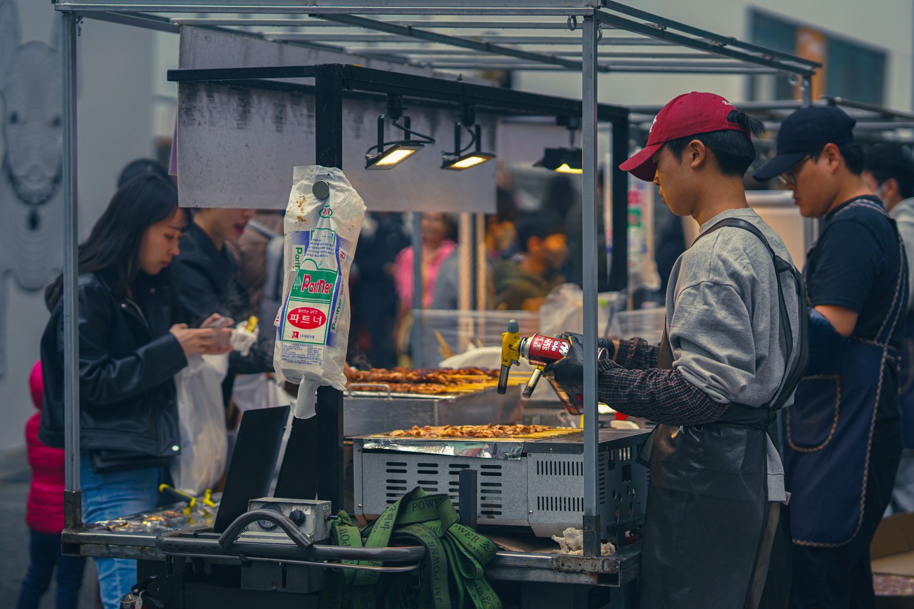 Korean street food stall with tteokbokki and hotteok